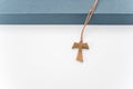 isolated hand made wooden tau cross pendant - Greek letter tau