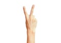 Isolated hand signal on white background, male adult hand making a two fingers peace sign Royalty Free Stock Photo