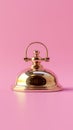 Golden Bell on Pink Background Royalty Free Stock Photo