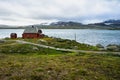 Isolated house on a lake in the Hardangervidda National Park near Finse, Norway Royalty Free Stock Photo