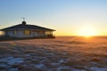 isolated house on a prairie, sunrise in the background Royalty Free Stock Photo