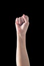 Isolated human`s arm with fist gesture on black background clipping path for Women rights empowering, international women`s day