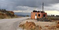 Isolated hut in a container on the edge in an isolated road for the accommodation of foreign workers Royalty Free Stock Photo