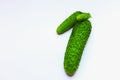 Bright green cucumbers on a white background. Royalty Free Stock Photo