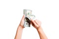 Isolated image of female hands counting dollars on white background. Top view of salary and wages concept