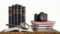 isolated images of an old camera, books and magnifier Royalty Free Stock Photo