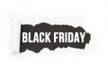 Isolated inscription `Black Friday` on a black background, paper rupture. Royalty Free Stock Photo