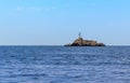 An isolated islet stands alone in the Gulf of Naples near Capri Island, Italy Royalty Free Stock Photo