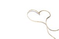 Isolated jute rope with shape heart on white background. Concept of love, celebration, care, health, life Royalty Free Stock Photo