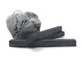 Isolated kneaded eraser with charcoal sticks Royalty Free Stock Photo
