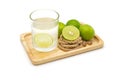 Isolated lemonade with fresh green lemons Royalty Free Stock Photo