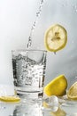Isolated lemonade, water splashing, cool beverage with lemons Royalty Free Stock Photo
