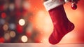 Isolated light red Christmas Stocking in front of a festive Background. Cheerful Template with Copy Space Royalty Free Stock Photo