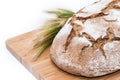 Isolated Loaf of bread on cutting board Royalty Free Stock Photo