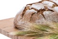 Isolated Loaf of bread on cutting board Royalty Free Stock Photo