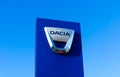 Isolated logo lettering of rumanian automobile manufacturer Dacia against cloudless blue sky Royalty Free Stock Photo