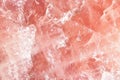 Isolated macro of large semi precious gemstone rose quartz surface showing matrix and texture