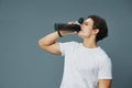 isolated man guy athletic fit t-shirt bottle exercise drink water sport Royalty Free Stock Photo