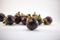 Isolated mangosteens. Plenty fruits isolated on white background Royalty Free Stock Photo