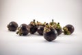 Isolated mangosteens. Plenty fruits isolated on white background Royalty Free Stock Photo