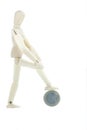 Isolated manikin standing on a coin