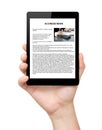 Isolated mans hand holding a tablet with business news on screen Royalty Free Stock Photo