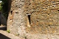 Isolated medieval walled window in an old brick wall Fiorenzuola di Focara, Italy, Europe