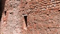 Isolated medieval walled window in an old brick wall Fiorenzuola di Focara, Italy, Europe