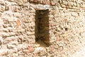 Isolated medieval walled window in an old brick wall Fiorenzuola di Focara, Italy, Europe