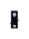 Isolated mini boutique black and clear knob booster stomp box pedal electric guitar effect on white background with clipping path. Royalty Free Stock Photo