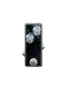 Isolated mini boutique black and clear knob vintage overdrive stomp box pedal electric guitar effect on white background. Royalty Free Stock Photo