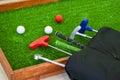 Mini-golf clubs and balls. Royalty Free Stock Photo