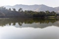 isolated mountain range with pristine lake reflection at morning from flat angle