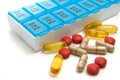 Isolated Multiple Vitamins and Medications with Weekly Container on White