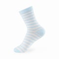 Isolated navy blue striped sock on invisible mannequin foot on white background, side view. Royalty Free Stock Photo