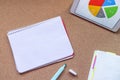 Isolated Notebook, white paper with copy space on a desk. Tablet with diagram. Blue marker Royalty Free Stock Photo