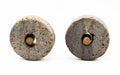 Isolated object shot of two stone wheels with wooden axles, the first invention made by a caveman.