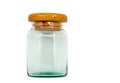 Isolated old glass jar with wooden lid. Vintage glass jar on white background, front view, empty space in the jar Royalty Free Stock Photo