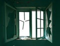 Isolated old window in abandoned house with cracked glass and broken window frame Royalty Free Stock Photo