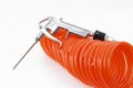 An isolated orange compressed air-hose and compressed air blower Royalty Free Stock Photo