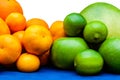 Isolated orange and green color groups citruses fruits on white background. Oranges, tangerines, limes, pummelo, grapefruits on Royalty Free Stock Photo