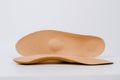 Isolated orthopedic insoles on a white background. Medical insoles. Foot care. Insole cutaway layers. Treatment and Royalty Free Stock Photo