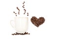 isolated cup of coffee and heart made of coffee beans Royalty Free Stock Photo