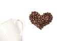 isolated cup of coffee and heart made of coffee beans Royalty Free Stock Photo