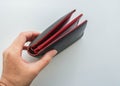 Isolated people hold leather money wallet in left hand for bill payment Royalty Free Stock Photo