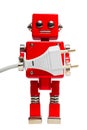 Isolated photo of red toy robot with euro electric plug Royalty Free Stock Photo
