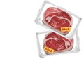 Isolated pice of meat prepared on white plate and wrap with plastic wrapped,