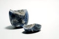 Isolated picture of broken lucky stone on white background