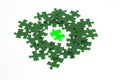 Isolated piece of green lumious jigsaw puzzle Royalty Free Stock Photo