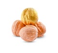 Isolated pile of nuts, three brown walnuts and one golden on white background Royalty Free Stock Photo